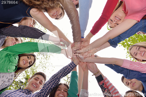 Image of young friends staying together outdoor in the park
