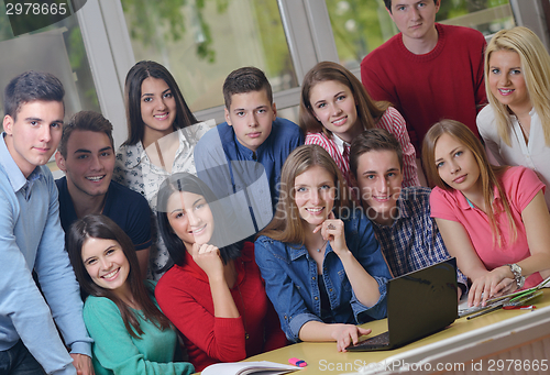 Image of happy teens group in school