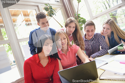 Image of happy teens group in school