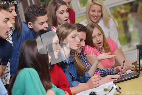 Image of happy teens group in school