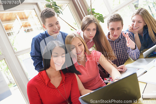 Image of happy teens group in school