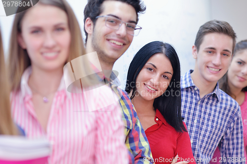 Image of happy teens group in school