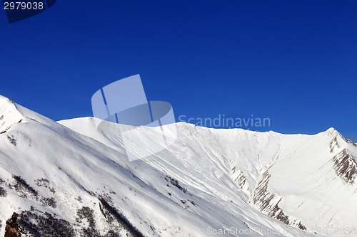 Image of Snowy mountains at nice sun day