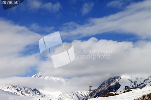 Image of Ski slope and blue sky with clouds