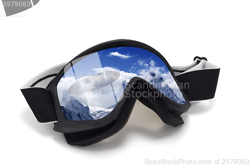 Image of Ski goggles with reflection of snowy mountains