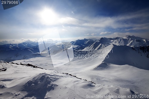 Image of Snowy mountains and view on off-piste slope