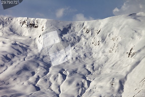 Image of View on off-piste snowy slope at evening