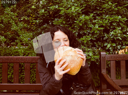 Image of Girl eating bread