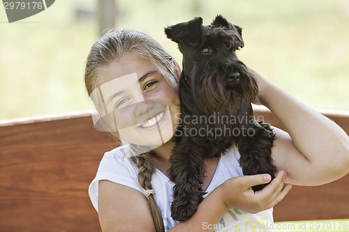 Image of Young girl with dog