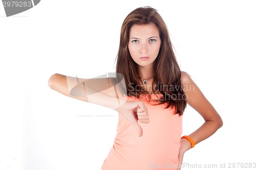 Image of Pretty girl with thumb down gesture