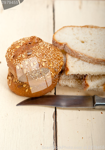 Image of organic bread over rustic table