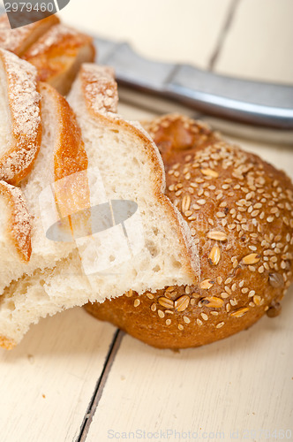 Image of organic bread over rustic table