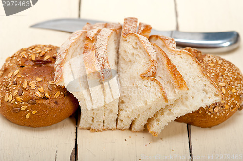 Image of organic bread over rustic table