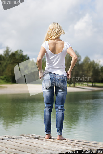 Image of Blond woman standing on jetty