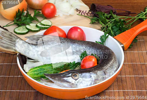 Image of Fish and components for her preparation: vegetables, spices, par