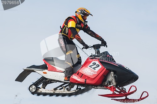 Image of High jump of sportsman on snowmobile