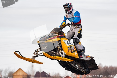 Image of High jump of sportsman on snowmobile