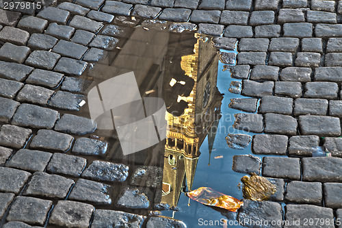 Image of Astronomical clock in Prague in puddle