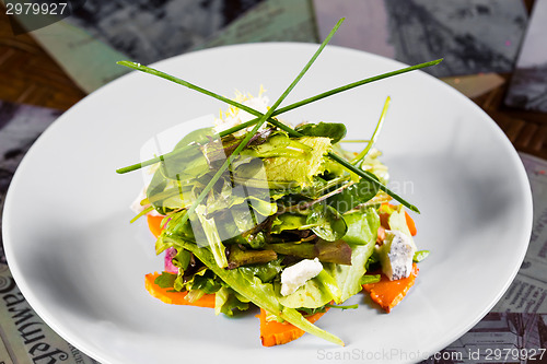 Image of Fresh organic vegetable salad with cheese.