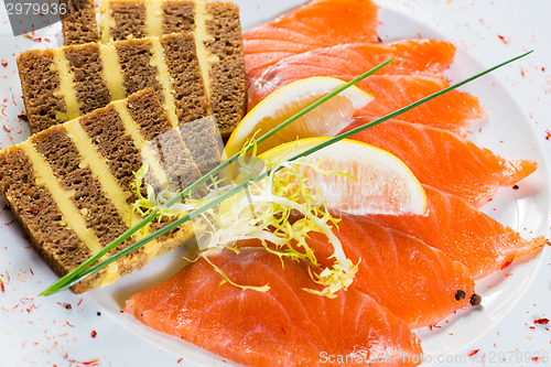 Image of Salmon snack on the white plate,