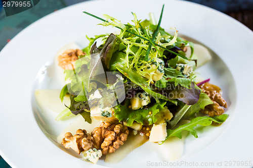 Image of Fresh organic vegetable salad on whte plate. 