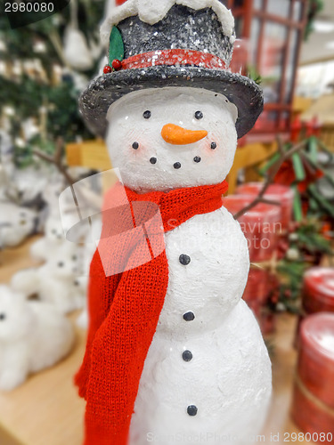 Image of Christmas snowman in a hat and scarf