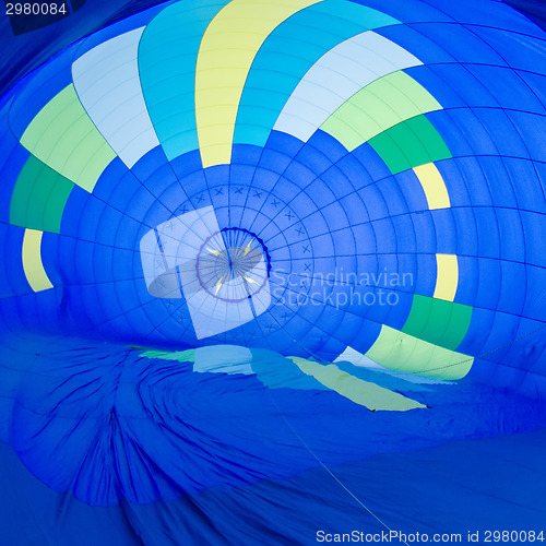 Image of Fire heats the air inside a hot air balloon at balloon festival 