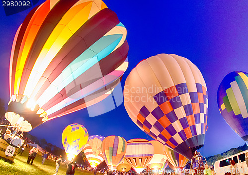 Image of Bright Hot Air Balloons Glowing at Night