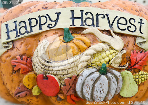 Image of happy harvest words on a pumpkin craft 