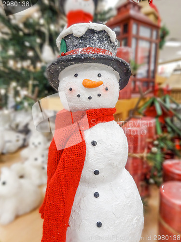 Image of Christmas snowman in a hat and scarf