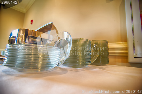 Image of Chafing Dish and glass plates  at buffet