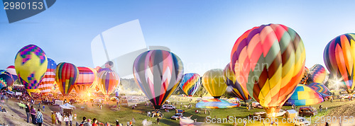 Image of Bright Hot Air Balloons Glowing at Night