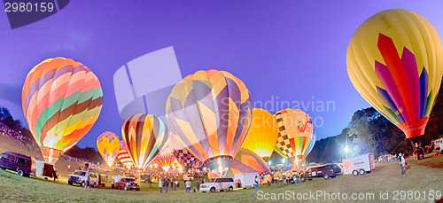Image of Bright Hot Air Balloons Glowing at Night