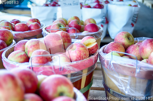 Image of Large bushel basket full of fresh locally grown red apples at lo