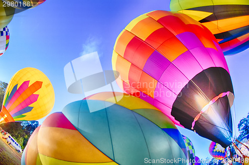 Image of Bright Hot Air Balloons Glowing at Night