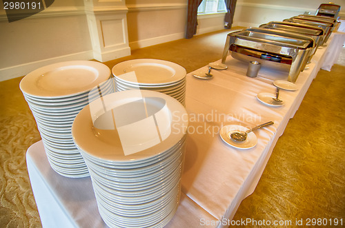 Image of Chafing Dish and glass plates  at buffet