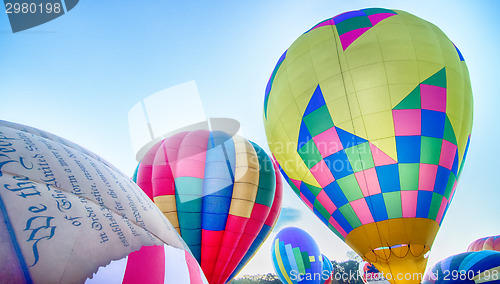 Image of Bright Hot Air Balloons Glowing at Night