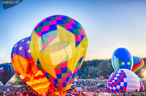 Image of Bright Hot Air Balloons Glowing at Night
