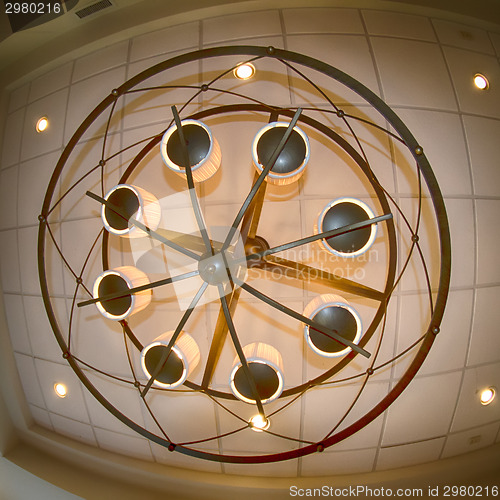 Image of looking up at large modern chandelier