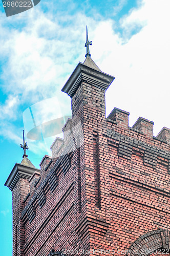 Image of old brick church abuilding in a city