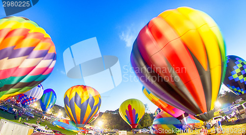 Image of Bright Hot Air Balloons Glowing at Night