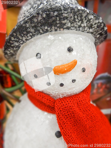 Image of Christmas snowman in a hat and scarf