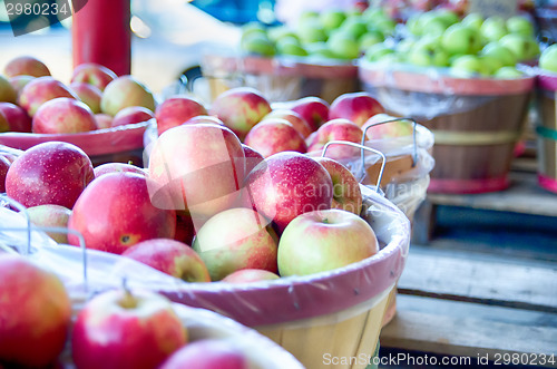 Image of Large bushel basket full of fresh locally grown red apples at lo
