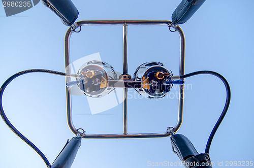 Image of hot air balloon burners on blue sky