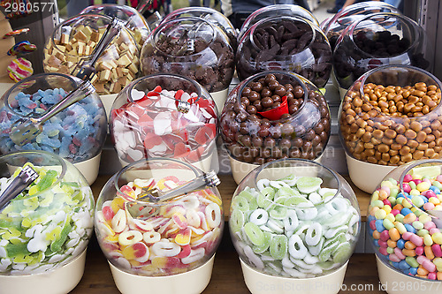 Image of Colorful candies in glass bowls