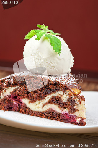 Image of chocolate cake with jam ice cream