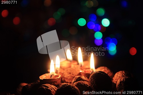 Image of candle from the walnut shells - christmas tradition