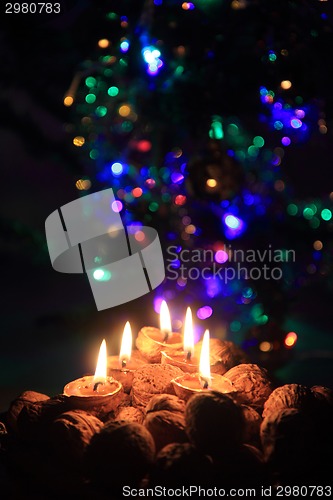 Image of candle from the walnut shells - christmas tradition