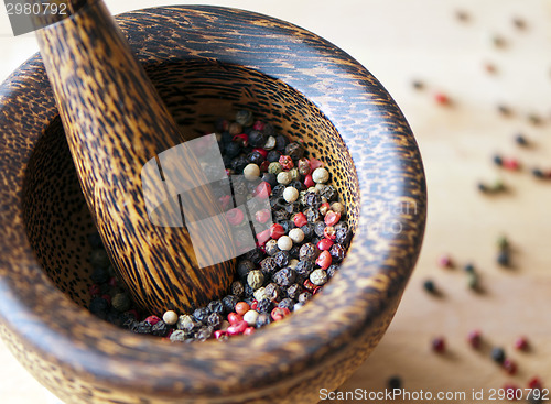 Image of Red, black, green and white peppercorns