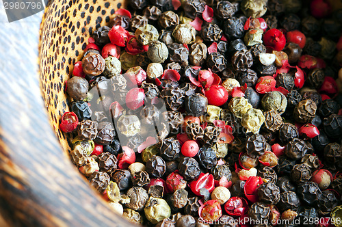 Image of Red, black, green and white peppercorns